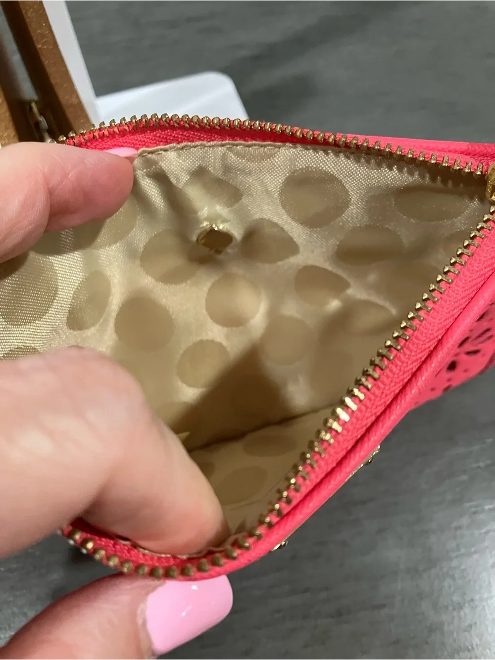 Kate Spade laser-cut floral wristlet clutch in pink